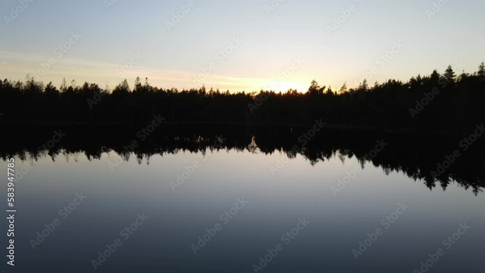 Aerial drone view of lakes and forests in Sweden at sunset on a sunny day Aerial drone view of lakes and forests in Sweden at sunset on a sunny day