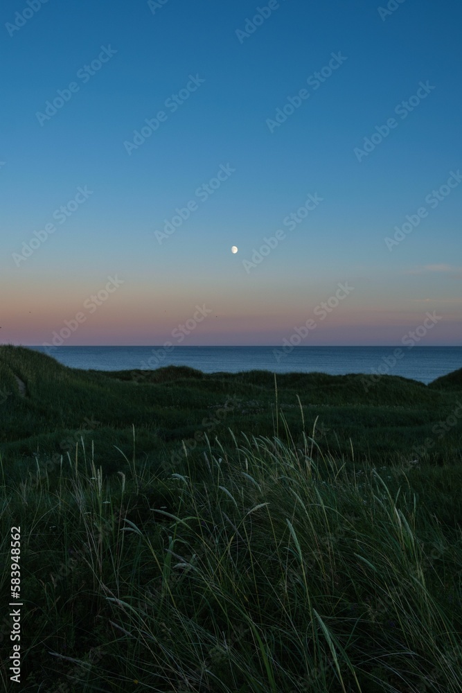 Beautiful sunset view of a dunes on a sea background