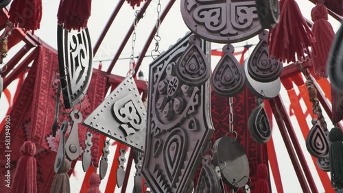 Decoration elements of asian holiday Nauryz are swaying in the wind