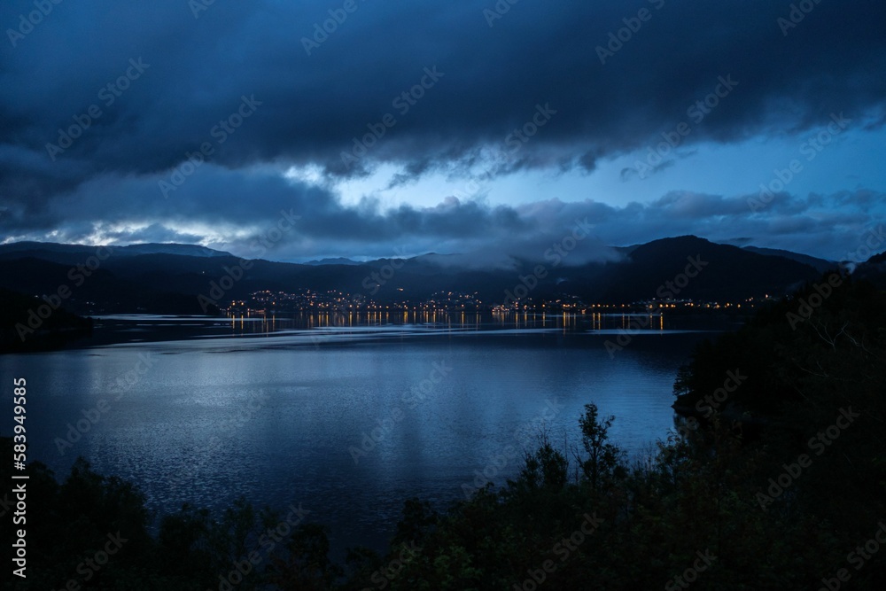 Beautiful shot of the Samnangerfjorden under a blue evening sky in Norway