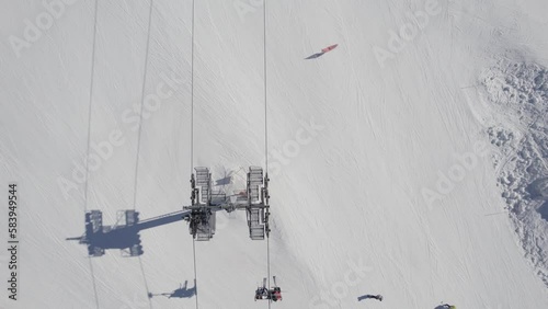Aerial shot of cableway with skiers