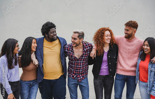 Group of multiracial young people having fun together outdoor - Diversity and frienship concept photo
