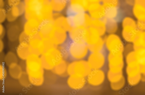 yellow light bokeh for background  Colorful abstract facula  blurry circles  abstract background. Blur out lots of yellow bokeh for the background for any media advertisement.