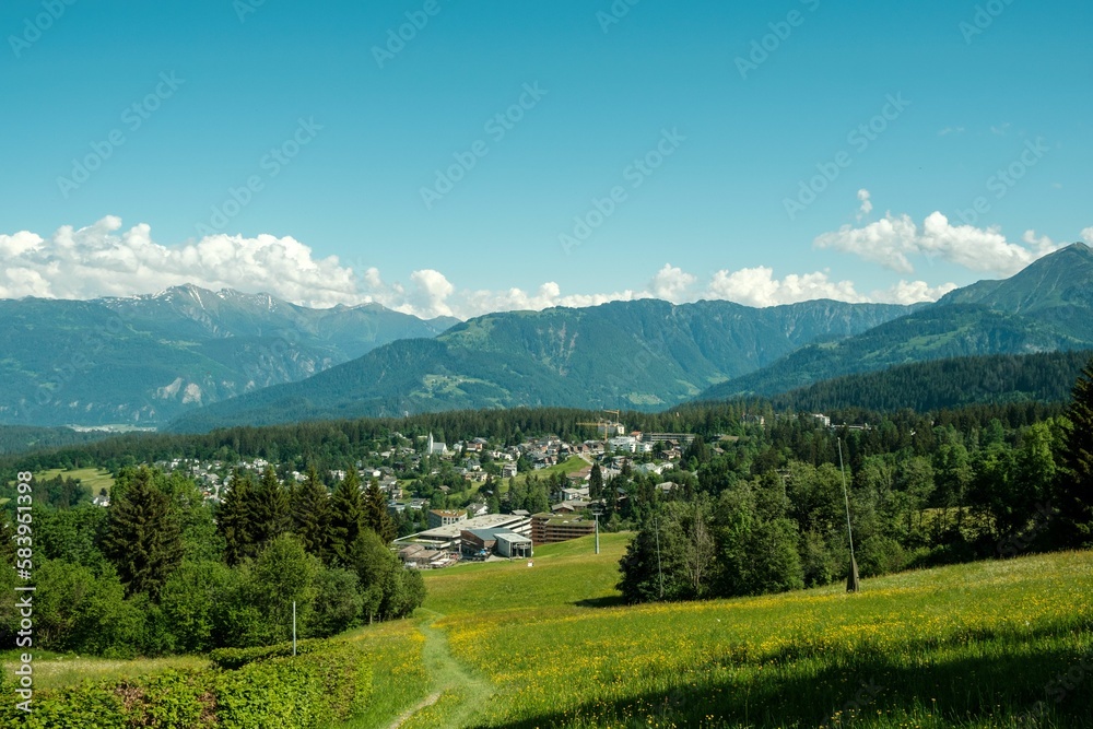 Beautiful view of the Flims town in the Swiss canton of Grisons under a blue sky in summer