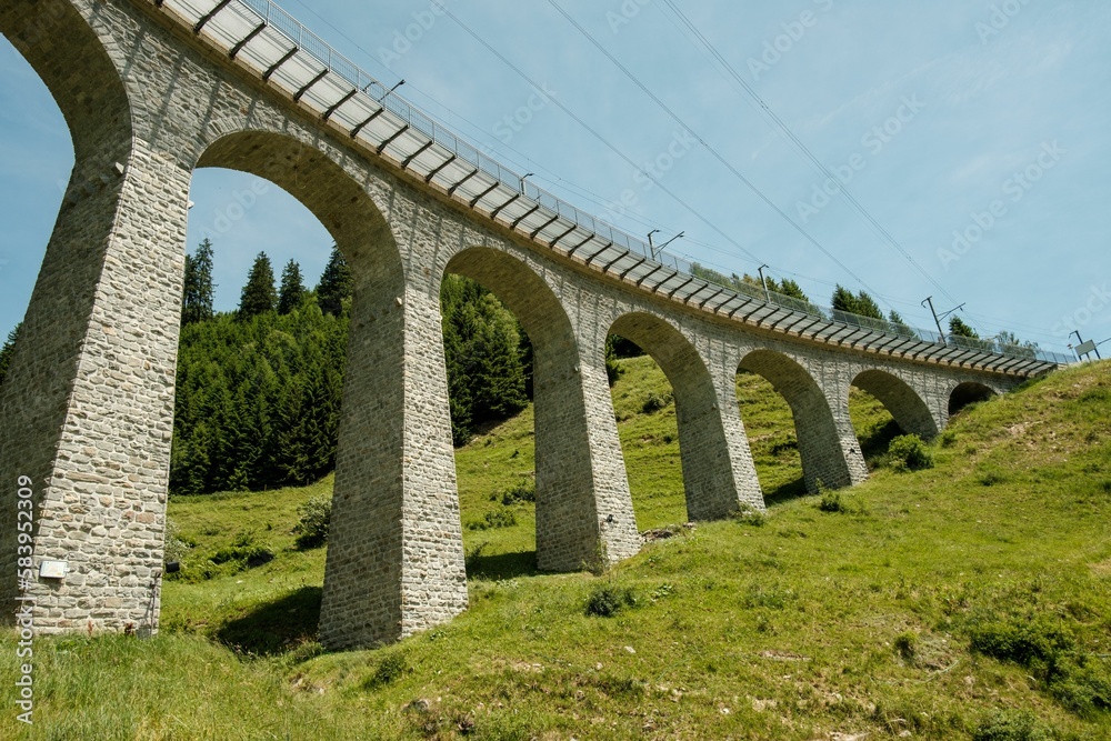 Scenic shot of the Spiral viaduct and its surrounding greenery in Brusio, Switzerland