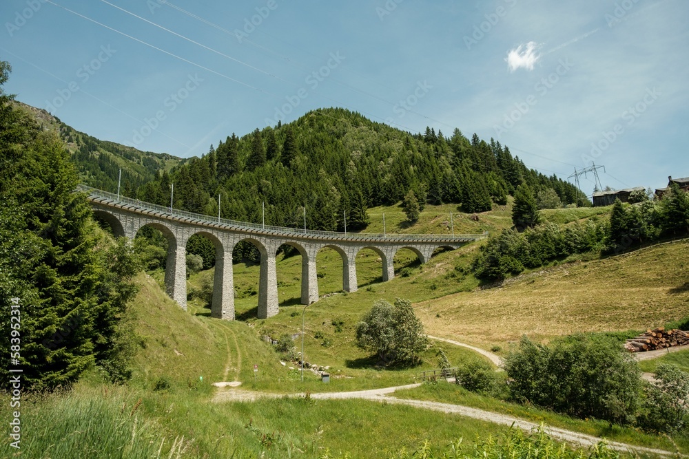 Scenic shot of the Spiral viaduct and its surrounding greenery in Brusio, Switzerland