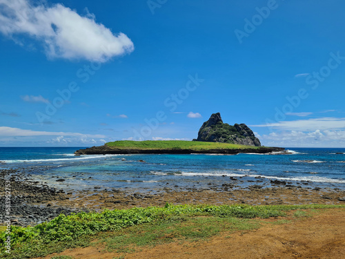 Beautiful ocean and island view of a secondary island in Fernando de Noronha, Brazil. A nice summer sunny day.