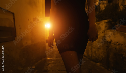Female prostitute with cigarette on the street. photo