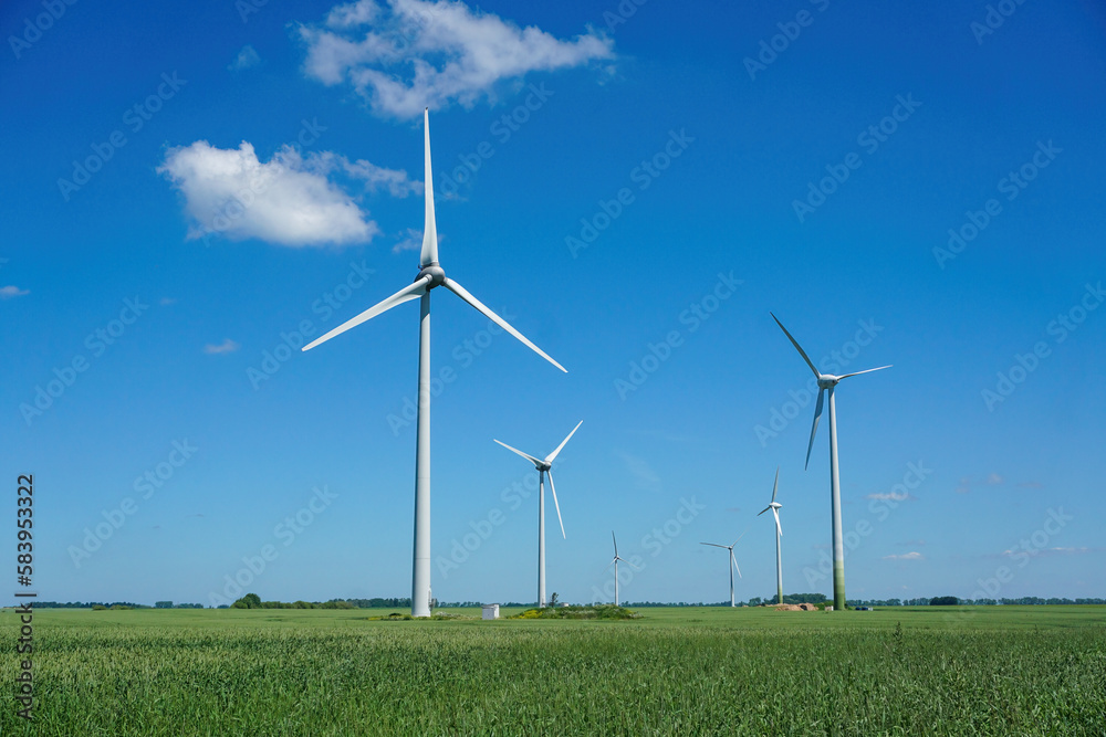 Wind turbines windmill energy farm. Summer time. Wind turbines windmill energy farm. Summer time.