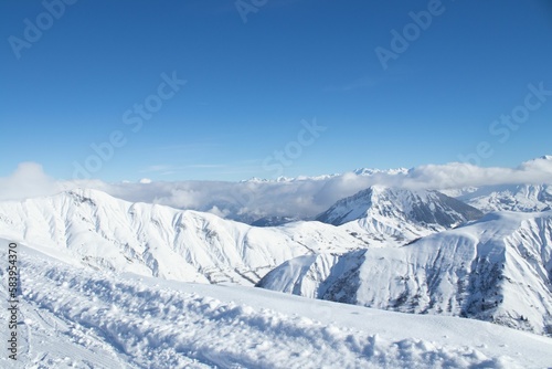 Aerial view of snow covered mountain landscape © Viktor17/Wirestock Creators