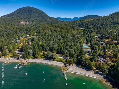 Snug Cove, Bowen Island, British Columbia, Canada. Aerial view of marina, pier, beach and resorts photo