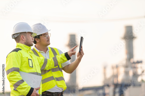 Group Asian man petrochemical engineer working at oil and gas refinery plant industry factory,The people worker man engineer work control at power plant energy industry manufacturing