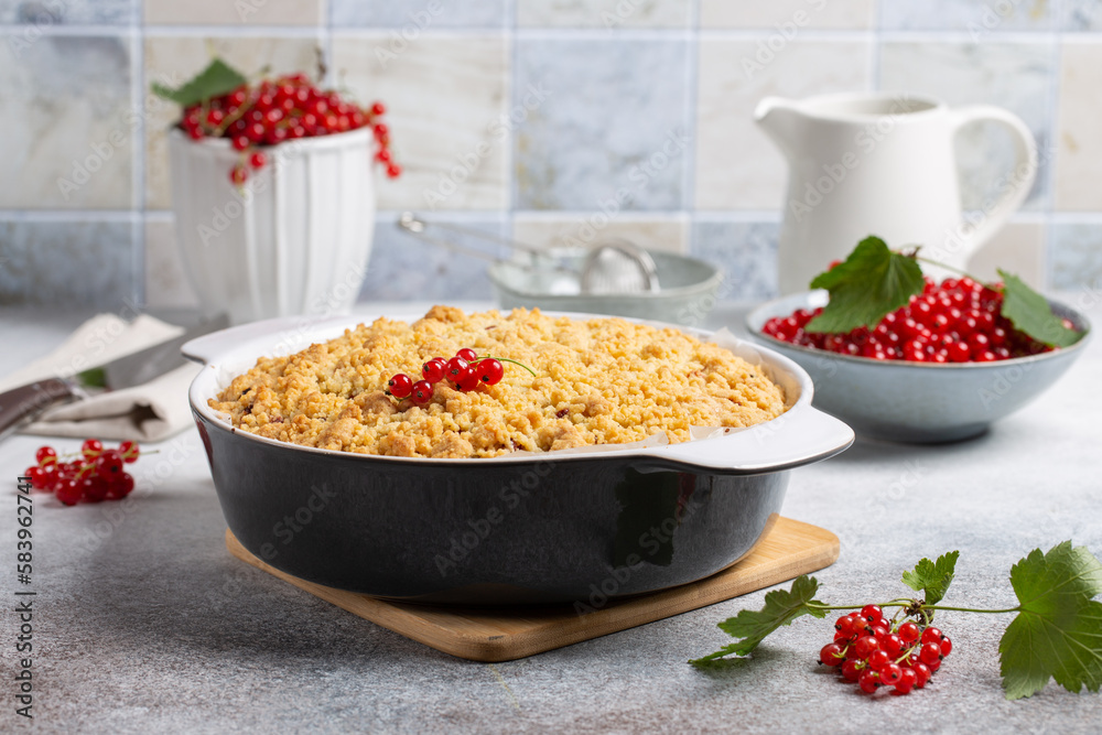 Homemade cake with berries on gray background. Yogurt pie with fresh red currant. Homemade cake with berries on gray background. Yogurt pie with fresh red currant.