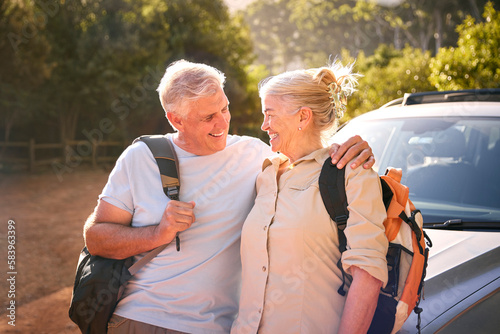 Portrait Of Senior Couple Going For Hike In Countryside Standing By Car Together © Monkey Business