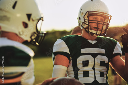 Football captain talking with his team photo