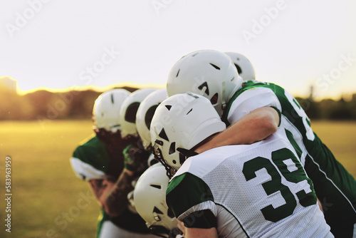 Football team standing together on a field
