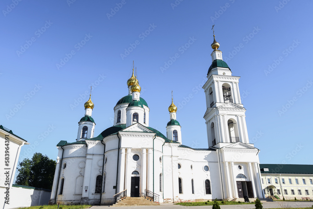 orthodox white church on the territory of the monastery, sunny summer day