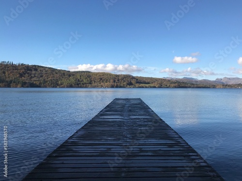 Wallpaper Mural Lake view with a wooden jetty and a blue sky background. Lake Windermere England.  Torontodigital.ca