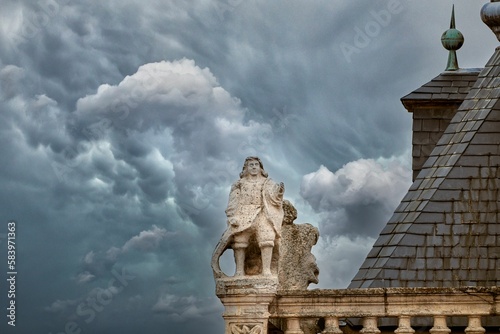 Statue of the tower of the Town Hall of Astorga with a cloudy sky. photo