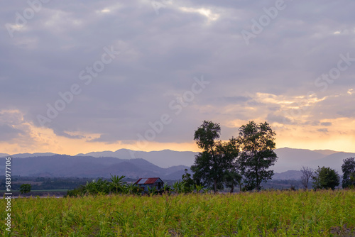 Inspirational landscape of distant ridge and agricultural fields in valley. Beautiful tropical scenery.