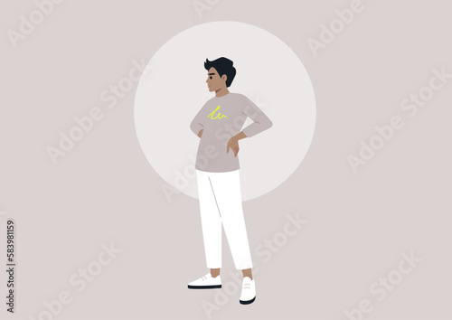 A Hispanic male in his youth standing with his hands on his hips, embodying a casual and modern lifestyle of the millennial generation
