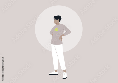 An Asian male in his youth standing with his hands on his hips, embodying a casual and modern lifestyle of the millennial generation
