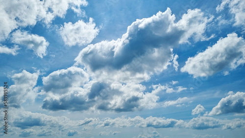 Photography White cloudy swimming under blue sky.