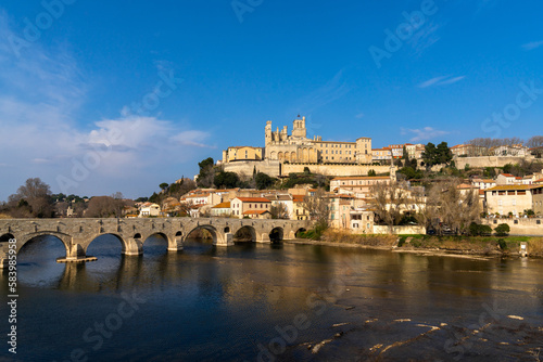 view of the historic old town center of Beziers with Saint Nazaire Church and Roman bridge over the river Orb