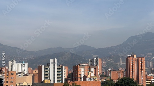 city skyline at sunset with mountains