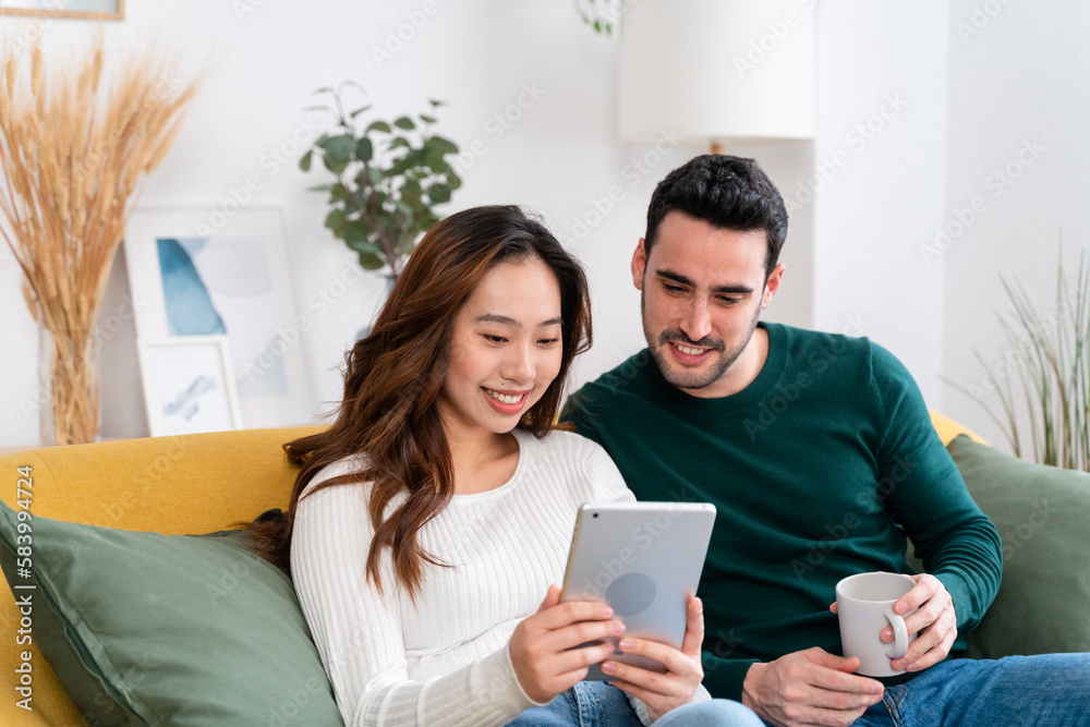 Happy couple using tablet together Happy couple using tablet together