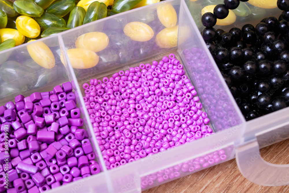 Colorful beads in containers close up, handicrafts Colorful beads in containers close up, handicrafts
