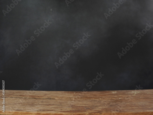 Empty Wooden Table on Black blurry Background. Copy space for text