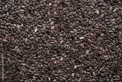  a pile of black seed is shown in close up view.  generative ai