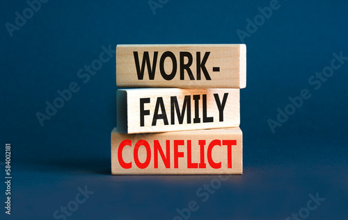 Work-family conflict symbol. Concept words Work-family conflict on wooden block on a beautiful grey table grey background. Business work-family conflict concept. Copy space.