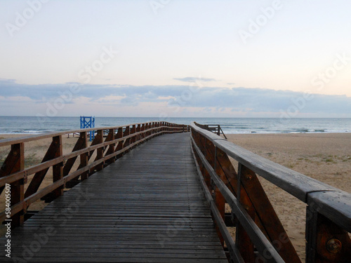 Nice wooden bridge over the sand on the beach