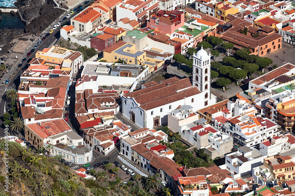 Roofs of buildings of historical town of Garachico. Belltower of the Church of Saint Anna (Iglesia de Santa Ana). The Garachico is an ancient town on the north. Aerial view. Tenerife, Canary, Spain