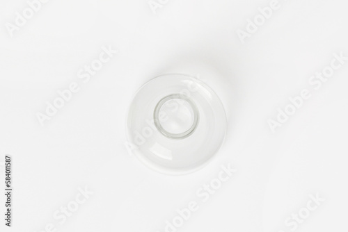 Empty conical laboratory flask on a light background. View from above.