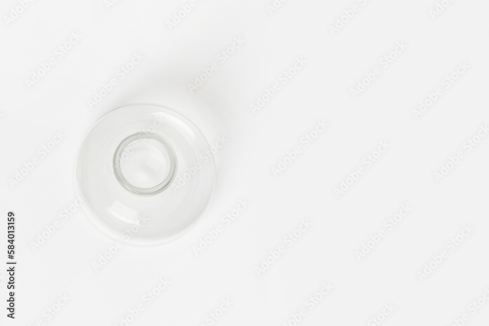 Empty conical laboratory flask on a light background. View from above.