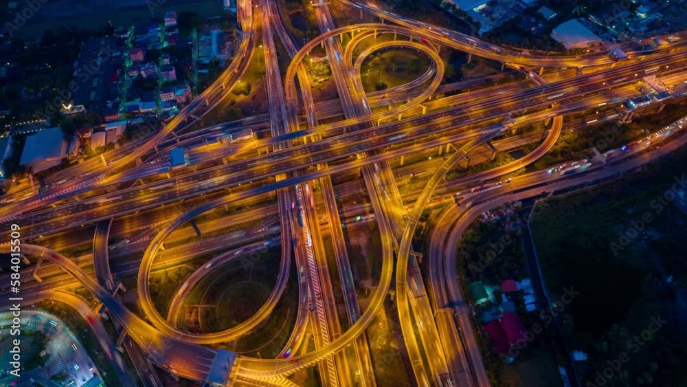 Aerial hyperlapse of traffic on massive highway intersection at night. Aerial hyperlapse of traffic on massive highway intersection at night.