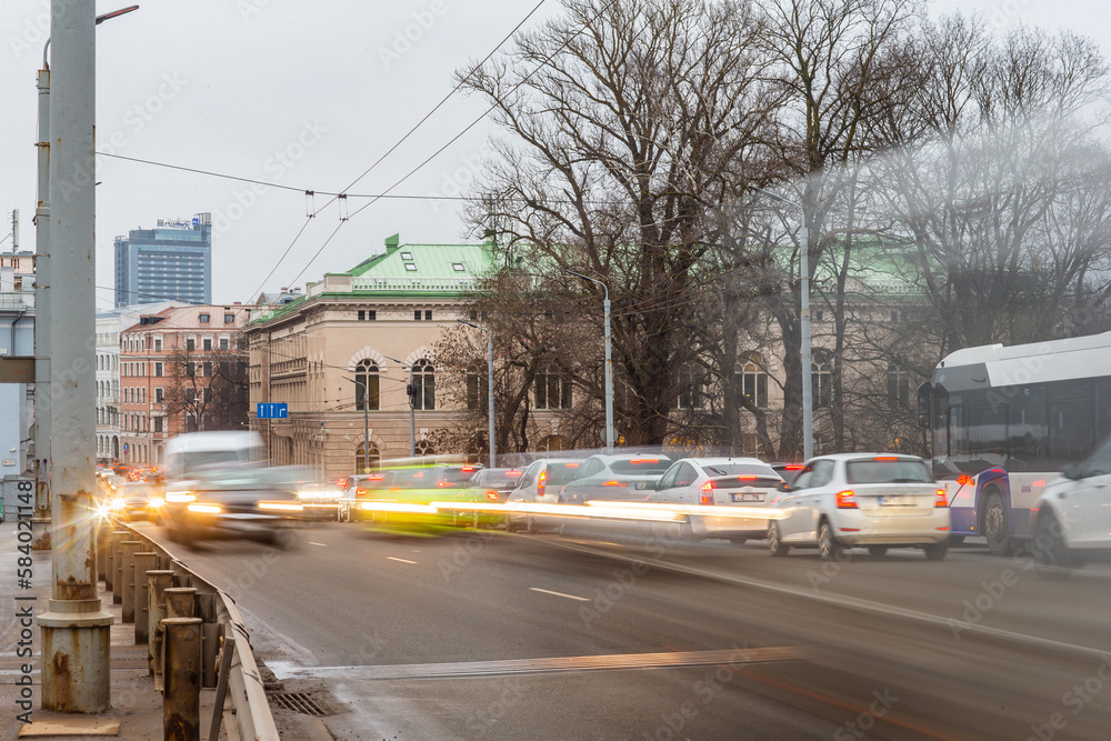 Traffic cars in motion during rush hour entering and exiting the city of Riga, Latvia