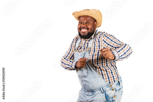 brazilian black man wearing country clothes from festa junina, festa de são joão. celebrating, feasting, dancing arraiá. photo