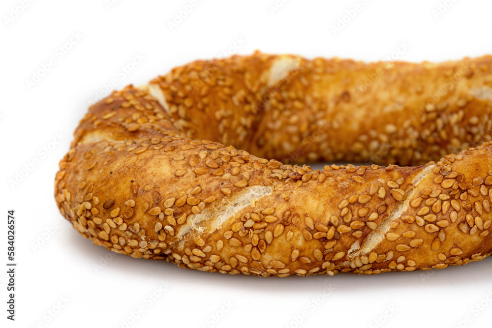 Turkish traditional bagel simit isolated on white background. Turkish Sesame Bagel. Turkish traditional bagel simit isolated on white background. Turkish Sesame Bagel.