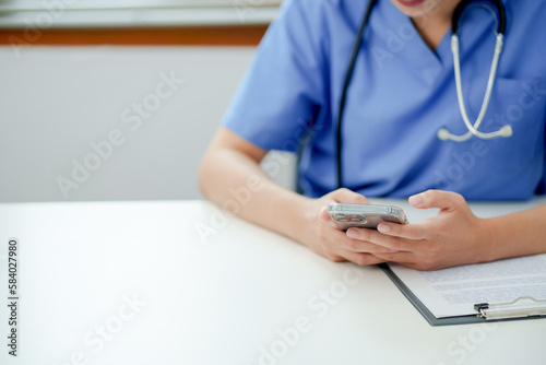 Medicine doctor using smartphone for Consultation Online.