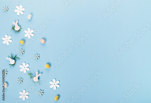 Festive Easter border, frame from easter eggs and spring flower crocus on blue background.
