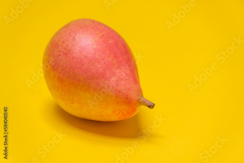 Organic Pear Coscia dell'Etna on a violet background. Juicy pear, cool minimal copy space  (ID: 584040540)