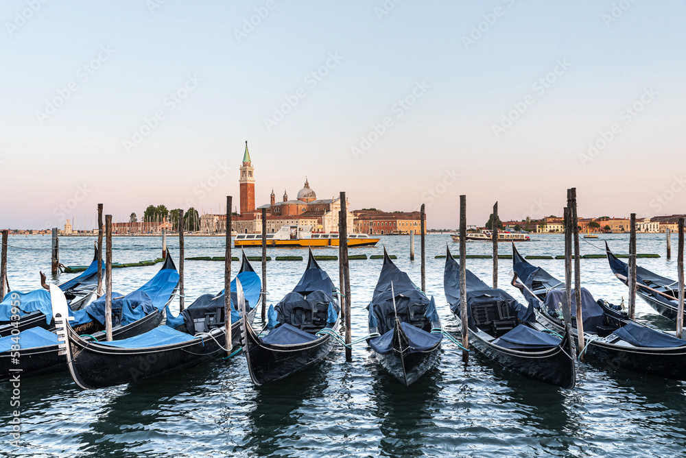 venetian gondolas on the water in front of the Markus tower