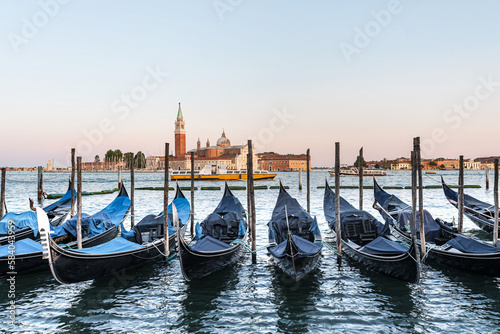 venetian gondolas on the water in front of the Markus tower