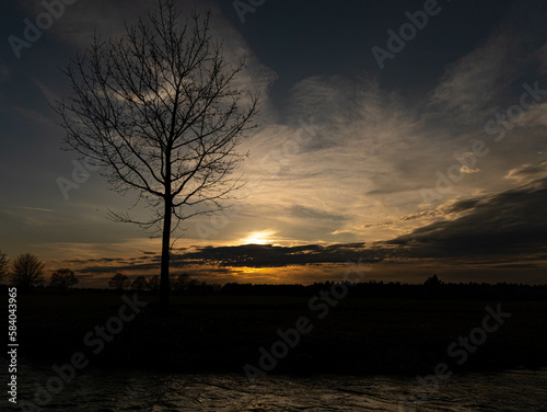 River Loch in a nature reserve in Germany. Spring sunset in the fields late in the evening.