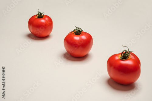 Red Tomatoes fresh organically grown on white background. Cool minimal flat lay, copy space (ID: 584046967)