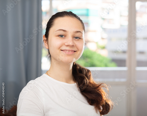Happy young attractive woman posing at modern home apartment © JackF